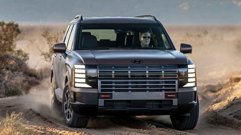 Hyundai Palisade XRT Pro 2026 acelerando na terra.